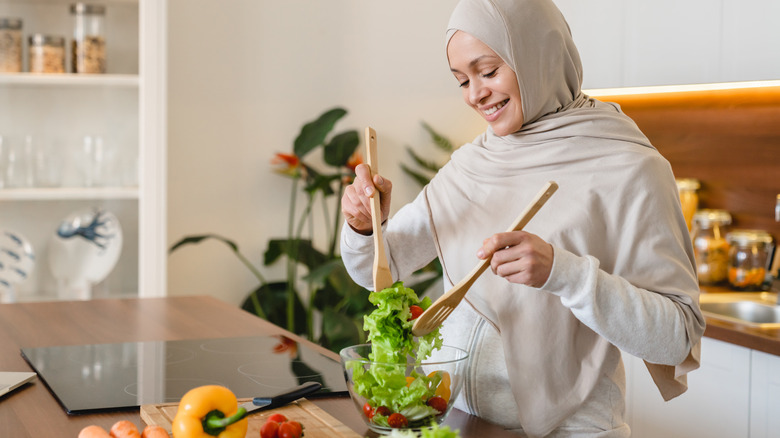 woman making salad