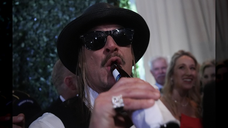 Kid Rock taking a drink at the Commander-in-Chief Ball