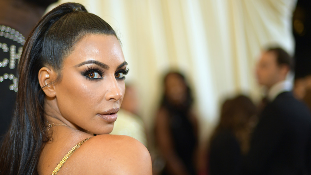 Kim Kardashian posing on the red carpet