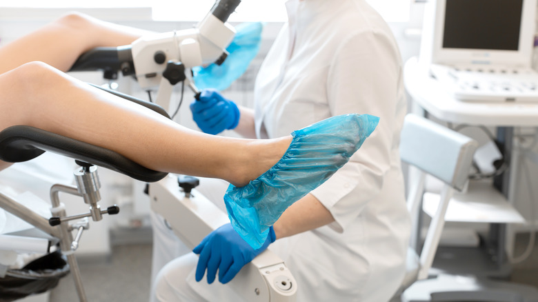 gynecologist examining patient