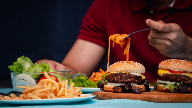 Person eating different foods