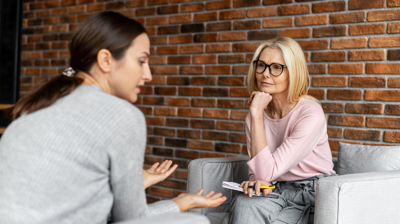 Woman patient sitting with therapist