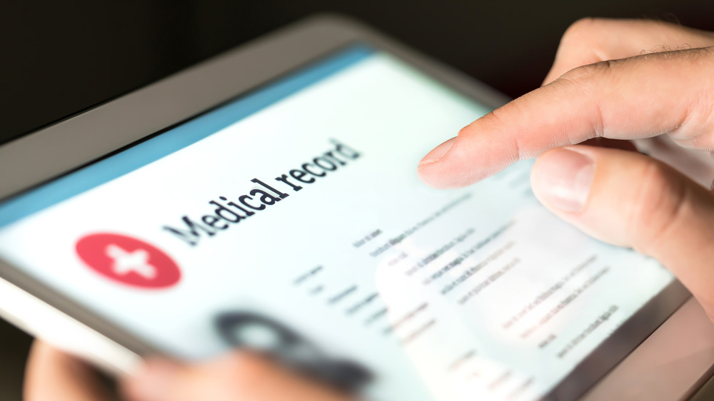 A tablet displaying a person's medical record