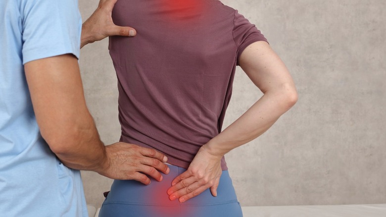 woman with neck and back pain