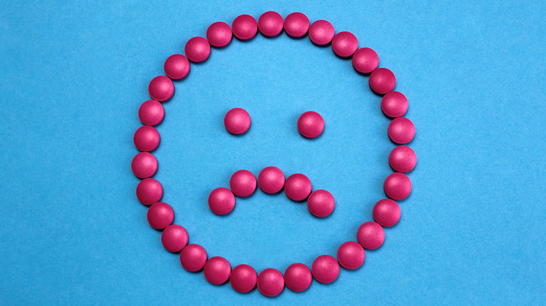Sad face made up of pills