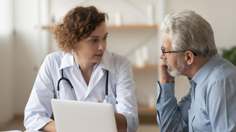 A doctor talks to a cancer patient