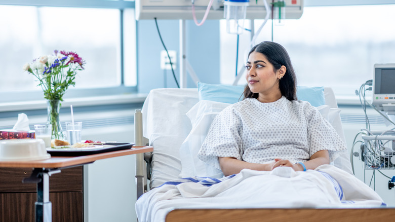 woman sitting in her hospital bed