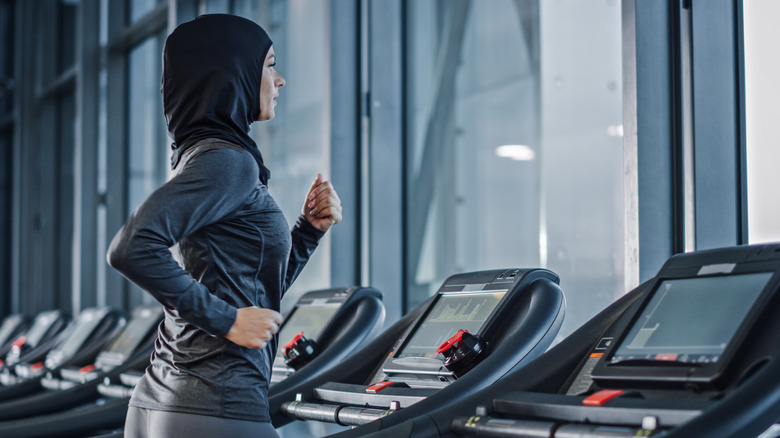 woman running on treadmill