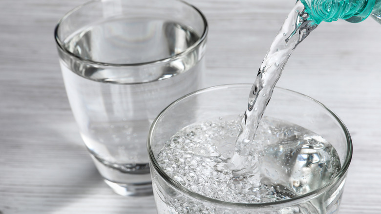 Pouring two glasses of water