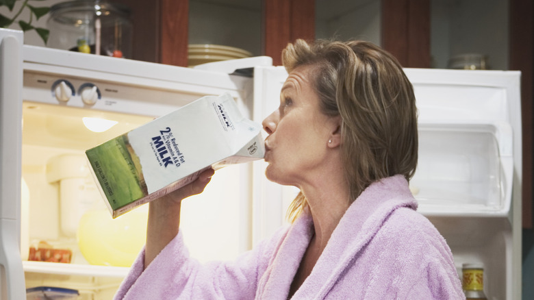 elderly woman drinking milk 