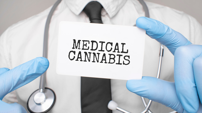Doctor holding "Medical Cannabis" sign
