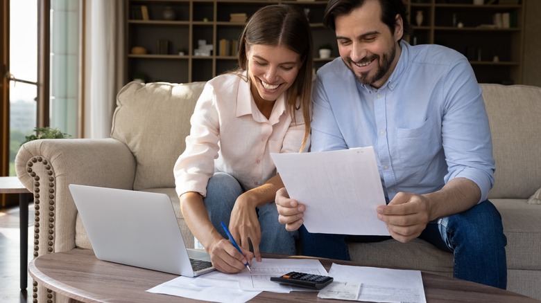 man and woman going over paperwork