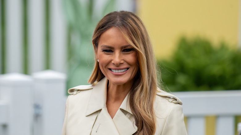 Melania Trump smiling outdoors