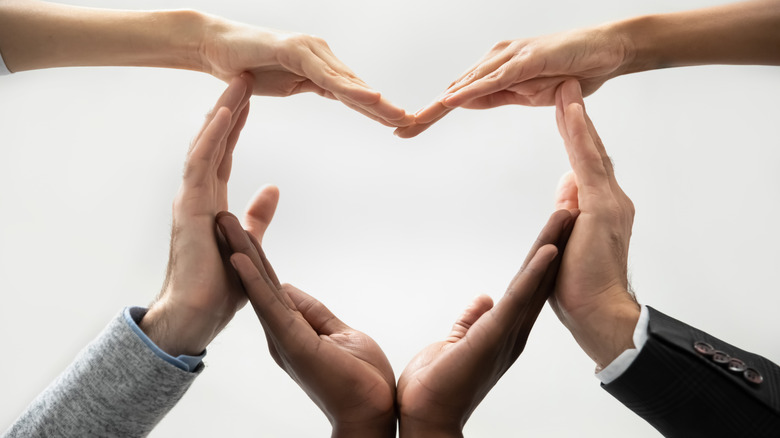 Sets of hands making a heart shape