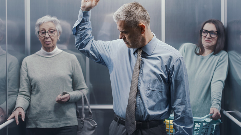 man in elevator whose smell offends two women