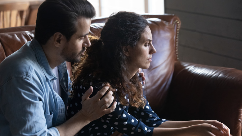 husband tries to console wife 