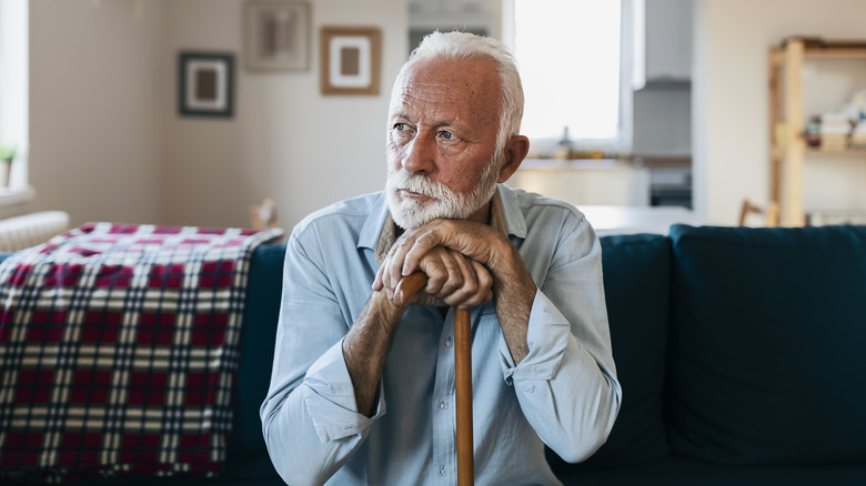 older man pensively looking away