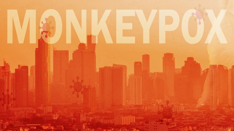 The word "MONKEYPOX" written across a city skyline