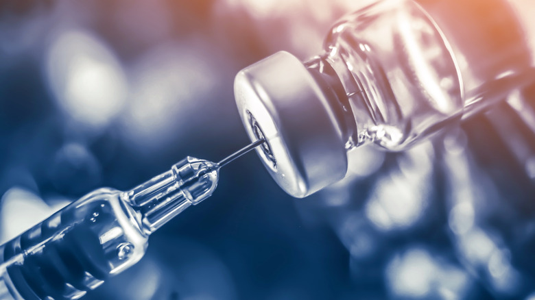 Close up of a syringe and a vial