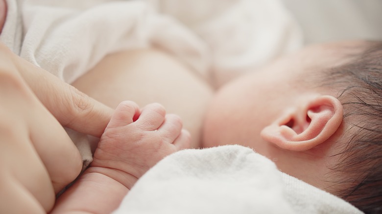 A mom in the midst of breastfeeding