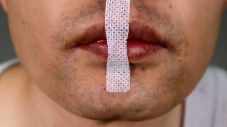 man wearing nasal breathing tape