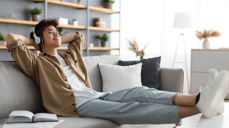 man relaxing with headphones 