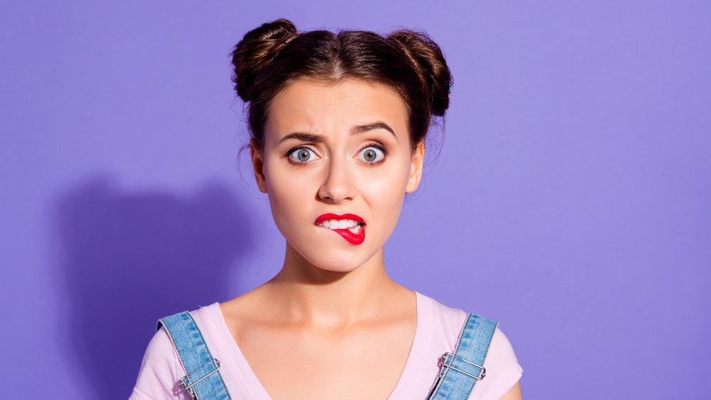 Close-up of a woman with buns