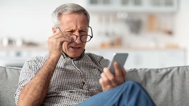 senior man with poor eyesight