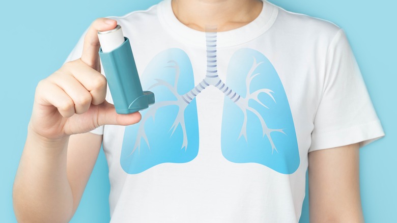 man holding asthma pump