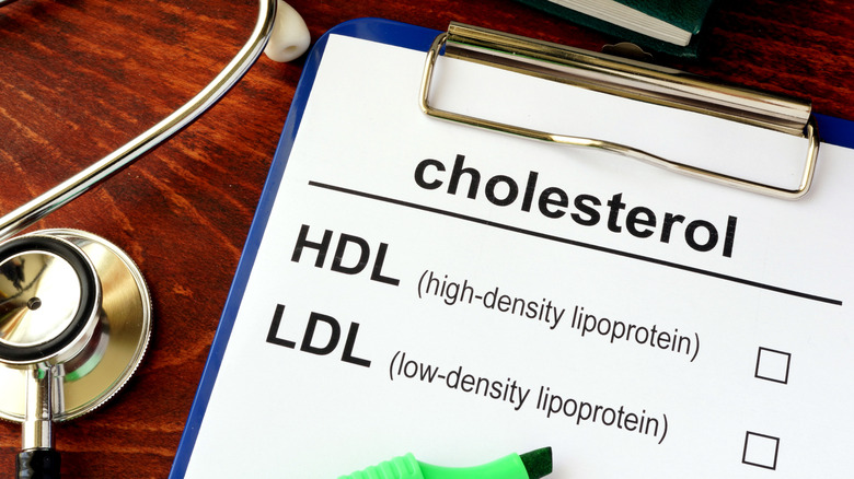 stethoscope and clipboard with cholesterol checkboxes