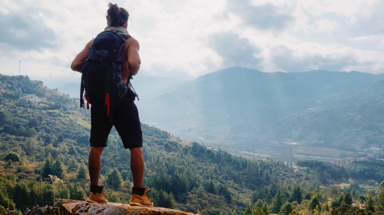 man hiking with man bun
