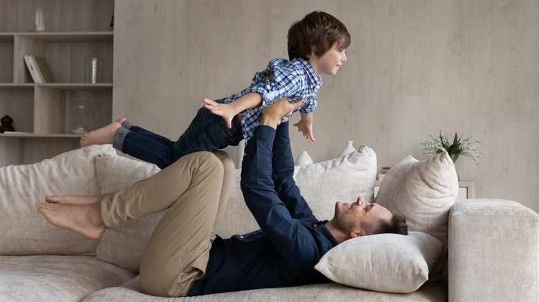 Father lifting up his son