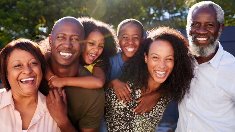 Family photo of people smiling