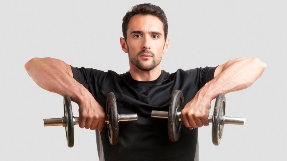 man performing upright rows
