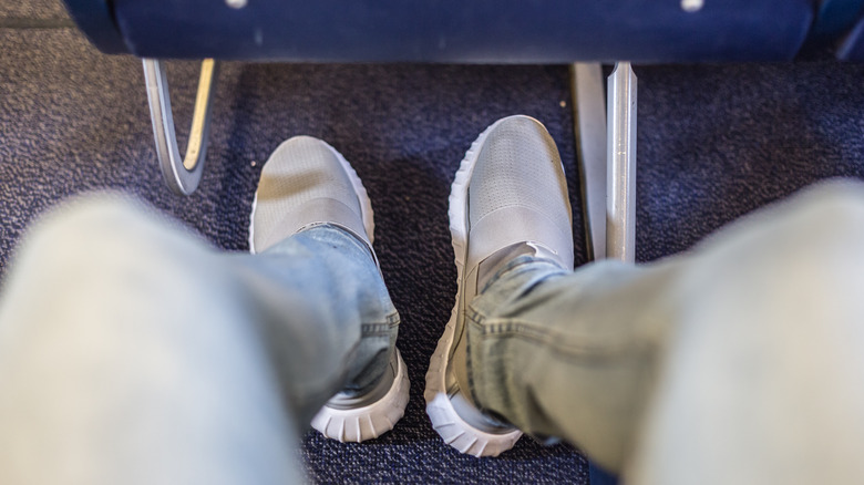 Person wearing shoes on a plane
