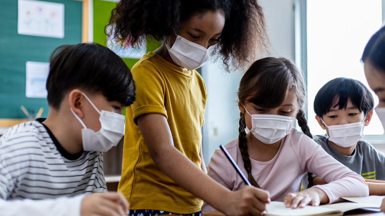 Children at school wearing masks