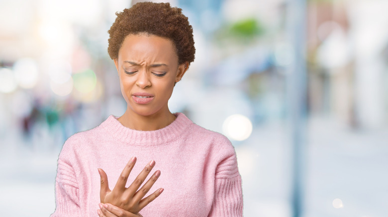 young women with pain in the hand