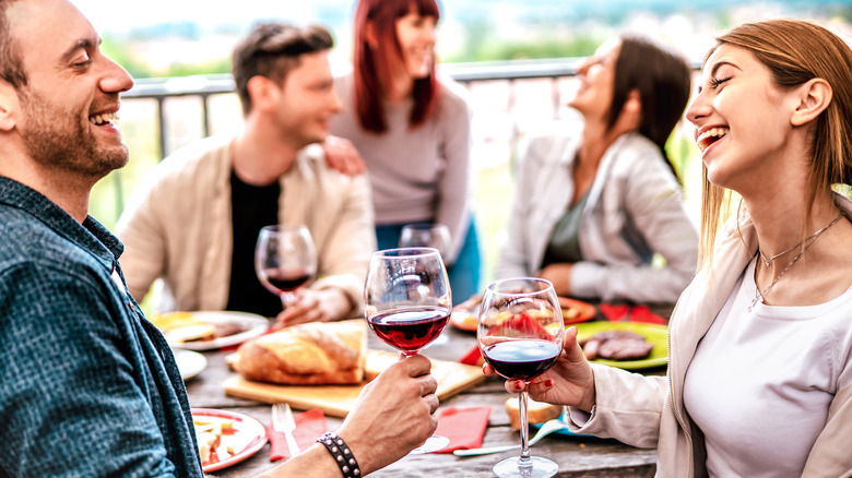 social people drinking red wine