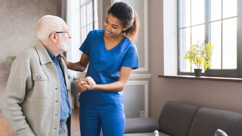 Nurse talking to old men