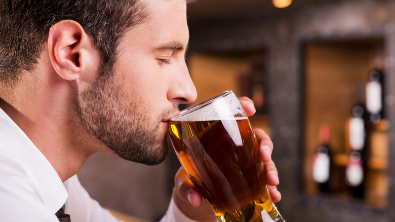 Man drinking pint of beer