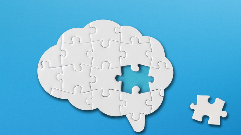 a brain with a missing puzzle piece 