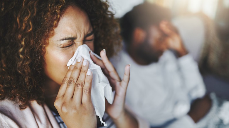 woman sneezing