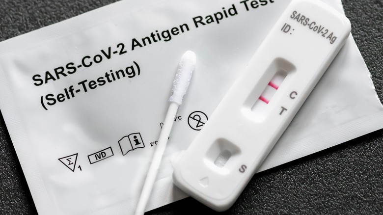 close-up of positive COVID test