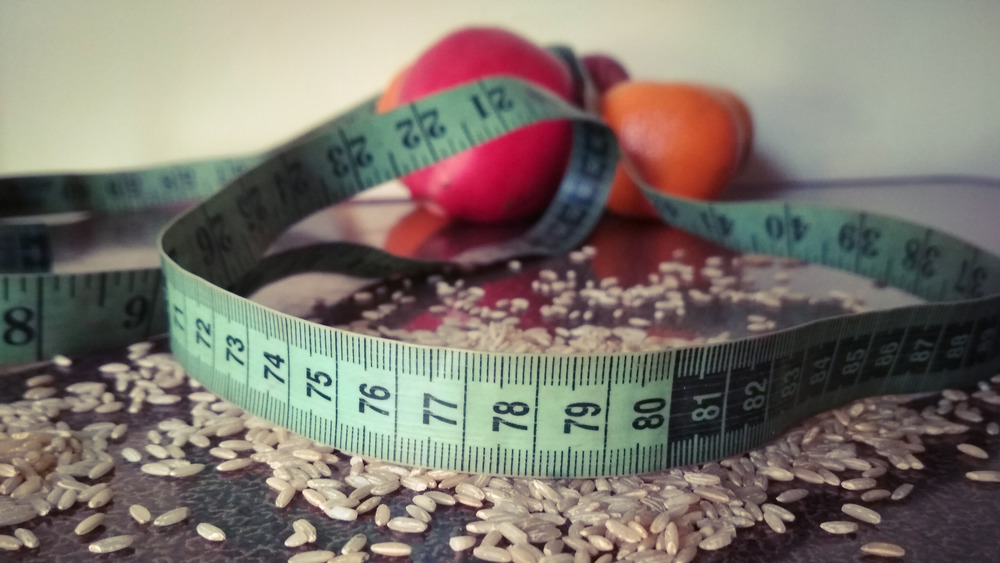 measuring tape and healthy foods