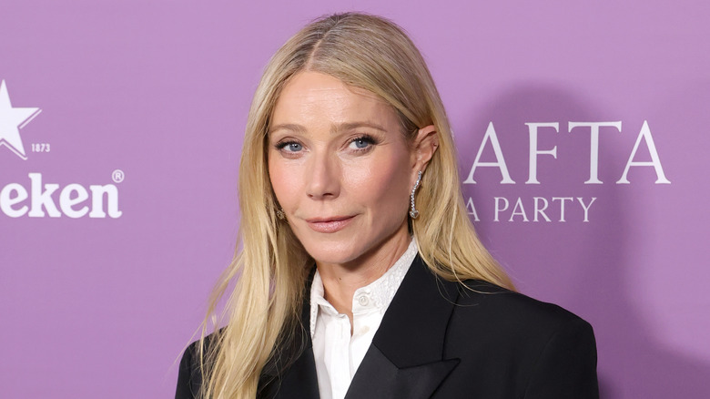 Gwyneth Paltrow posing in a black suit