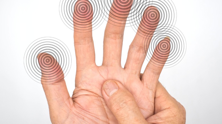 person massages tingling hand