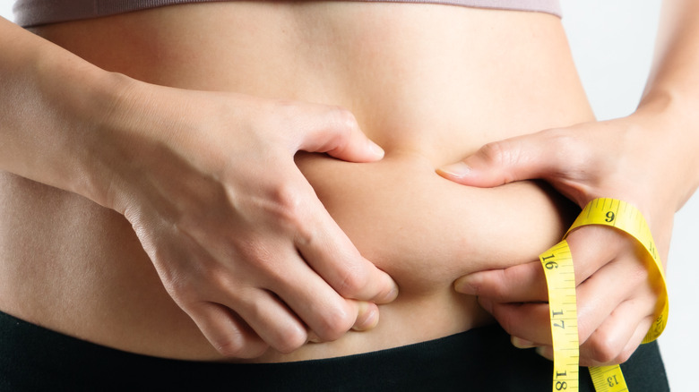Person squeezing belly