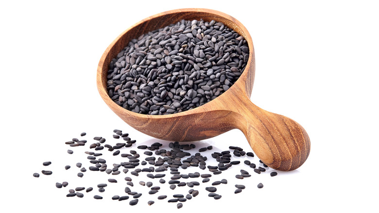 Chia seeds with a wooden spoon