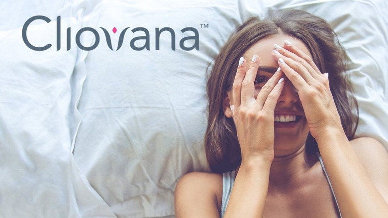 Woman smiling in bed with the Cliovana logo