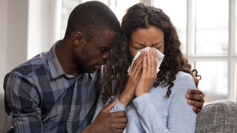 Young couple consoling each other
